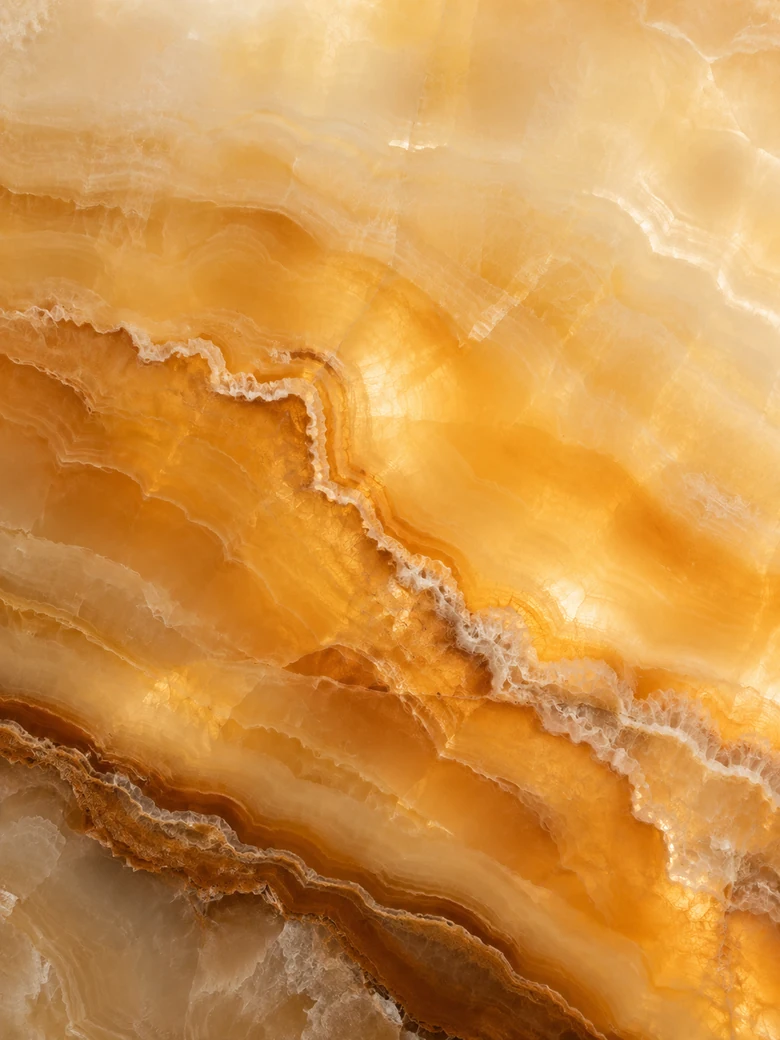 Honey onyx surface with translucent amber layers and dramatic banding